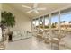 Bright sunroom overlooking canal, furnished with wicker furniture at 3800 Bal Harbor Blvd # 312, Punta Gorda, FL 33950