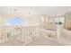 Open loft overlooking main living space with large window at 3800 Bal Harbor Blvd # 312, Punta Gorda, FL 33950
