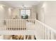 Spacious loft area with balcony overlooking the main living area at 3800 Bal Harbor Blvd # 312, Punta Gorda, FL 33950