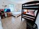 Bedroom with full-size bed, bunk beds, and tile floors at 683 W Tarpon Nw Blvd, Port Charlotte, FL 33952