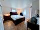 Main bedroom with dark wood furniture and ample natural light at 683 W Tarpon Nw Blvd, Port Charlotte, FL 33952
