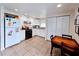 Cozy kitchen features white cabinets, tile floors and a breakfast nook at 683 W Tarpon Nw Blvd, Port Charlotte, FL 33952