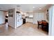 Efficient kitchen with white cabinets, tile floors, and breakfast area at 683 W Tarpon Nw Blvd, Port Charlotte, FL 33952