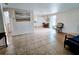 Bright living room with tile floors and access to kitchen and bedroom at 683 W Tarpon Nw Blvd, Port Charlotte, FL 33952