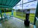 Relaxing screened porch with seating and backyard view at 683 W Tarpon Nw Blvd, Port Charlotte, FL 33952