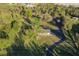 House nestled in a wooded area with a long private drive at 1010 Robinhood Dr, Punta Gorda, FL 33982
