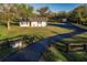 Single story home with a long private drive and detached shed at 1010 Robinhood Dr, Punta Gorda, FL 33982