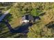 Aerial view of house, yard, and driveway at 1010 Robinhood Dr, Punta Gorda, FL 33982
