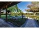 Spacious backyard with a hammock, patio and fire pit at 1010 Robinhood Dr, Punta Gorda, FL 33982