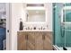 Elegant bathroom with double sinks, a large mirror, and a walk-in shower at 1010 Robinhood Dr, Punta Gorda, FL 33982