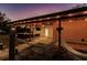 Evening view of covered patio with hammocks and lights at 1010 Robinhood Dr, Punta Gorda, FL 33982