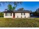 Newly renovated home exterior featuring a modern design and landscaping at 1010 Robinhood Dr, Punta Gorda, FL 33982