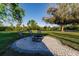 Relaxing fire pit area with brick pavers and seating at 1010 Robinhood Dr, Punta Gorda, FL 33982