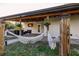 Peaceful patio with a hammock, hot tub, and fire pit at 1010 Robinhood Dr, Punta Gorda, FL 33982