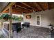 Covered patio with hot tub and seating area at 1010 Robinhood Dr, Punta Gorda, FL 33982