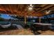 Covered patio with hot tub, seating, and string lights at 1010 Robinhood Dr, Punta Gorda, FL 33982