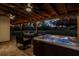 Covered patio with hot tub, seating, and string lights at 1010 Robinhood Dr, Punta Gorda, FL 33982