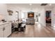 Open living room with hardwood floors, fireplace, and a view into the kitchen at 1010 Robinhood Dr, Punta Gorda, FL 33982