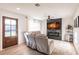 Bright living room with a fireplace, large TV, and comfortable seating at 1010 Robinhood Dr, Punta Gorda, FL 33982