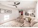 Open concept living room with a sectional sofa and view into the kitchen at 1010 Robinhood Dr, Punta Gorda, FL 33982