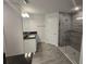 This bathroom features a tiled shower, granite countertops, and white cabinets at 14146 Baracoa Ln, Port Charlotte, FL 33981