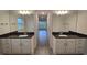 Bright bathroom with double vanity, granite counters, and tile floors; lots of space at 14146 Baracoa Ln, Port Charlotte, FL 33981