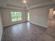 Bedroom with tile flooring, large window and view to the backyard at 14146 Baracoa Ln, Port Charlotte, FL 33981