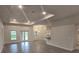 Open concept living room featuring recessed lighting, large windows and tile floors at 14146 Baracoa Ln, Port Charlotte, FL 33981