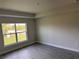 Bright bedroom with a large window providing natural light and tile flooring at 14154 Baracoa Ln, Port Charlotte, FL 33981