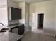 Kitchen with dark cabinets, granite countertops, stainless steel sink, and open layout at 14154 Baracoa Ln, Port Charlotte, FL 33981