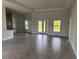 Open-concept living room featuring neutral paint, recessed lighting and tile flooring at 14154 Baracoa Ln, Port Charlotte, FL 33981