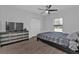 Spacious bedroom with wood-look floors and ceiling fan at 17494 Iago Ave, Port Charlotte, FL 33954