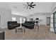 Bright living room featuring recessed lighting and two black leather recliners at 17494 Iago Ave, Port Charlotte, FL 33954