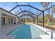 Screened-in pool and patio area, ideal for outdoor relaxation at 17494 Iago Ave, Port Charlotte, FL 33954