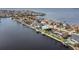 Waterfront property; aerial view showing house, dock, and canal at 1925 Jamaica Way, Punta Gorda, FL 33950