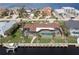 Aerial view of canal front home with private pool and dock at 1925 Jamaica Way, Punta Gorda, FL 33950