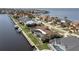Waterfront property showcasing a large home with a pool and private dock at 1925 Jamaica Way, Punta Gorda, FL 33950