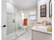 Modern bathroom with a large walk-in shower, tile flooring, and updated vanity at 1925 Jamaica Way, Punta Gorda, FL 33950