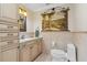 Small bathroom with toilet, vanity, and storage at 1925 Jamaica Way, Punta Gorda, FL 33950