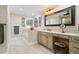 Elegant bathroom with a large vanity, soaking tub and walk in shower at 1925 Jamaica Way, Punta Gorda, FL 33950