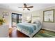 Bright bedroom with pool view and ceiling fan at 1925 Jamaica Way, Punta Gorda, FL 33950
