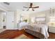 Serene bedroom featuring hardwood floors, neutral tones, and ample closet space at 1925 Jamaica Way, Punta Gorda, FL 33950