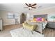 Spacious primary bedroom with wood floors and access to the pool at 1925 Jamaica Way, Punta Gorda, FL 33950