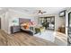 Main bedroom with wood flooring, sliding doors to patio, and large bed at 1925 Jamaica Way, Punta Gorda, FL 33950