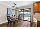 Breakfast nook with glass table and sliding doors to patio at 1925 Jamaica Way, Punta Gorda, FL 33950