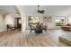 Open concept dining area with a glass-top table and wood chairs at 1925 Jamaica Way, Punta Gorda, FL 33950