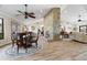 Bright dining area with stone fireplace and hardwood floors at 1925 Jamaica Way, Punta Gorda, FL 33950