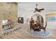 Bright dining room with stone fireplace and a glass-top dining table at 1925 Jamaica Way, Punta Gorda, FL 33950