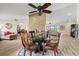 Bright dining room features a glass-top table and hardwood floors at 1925 Jamaica Way, Punta Gorda, FL 33950