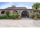 Ornate iron gate entry to a Mediterranean style home at 1925 Jamaica Way, Punta Gorda, FL 33950